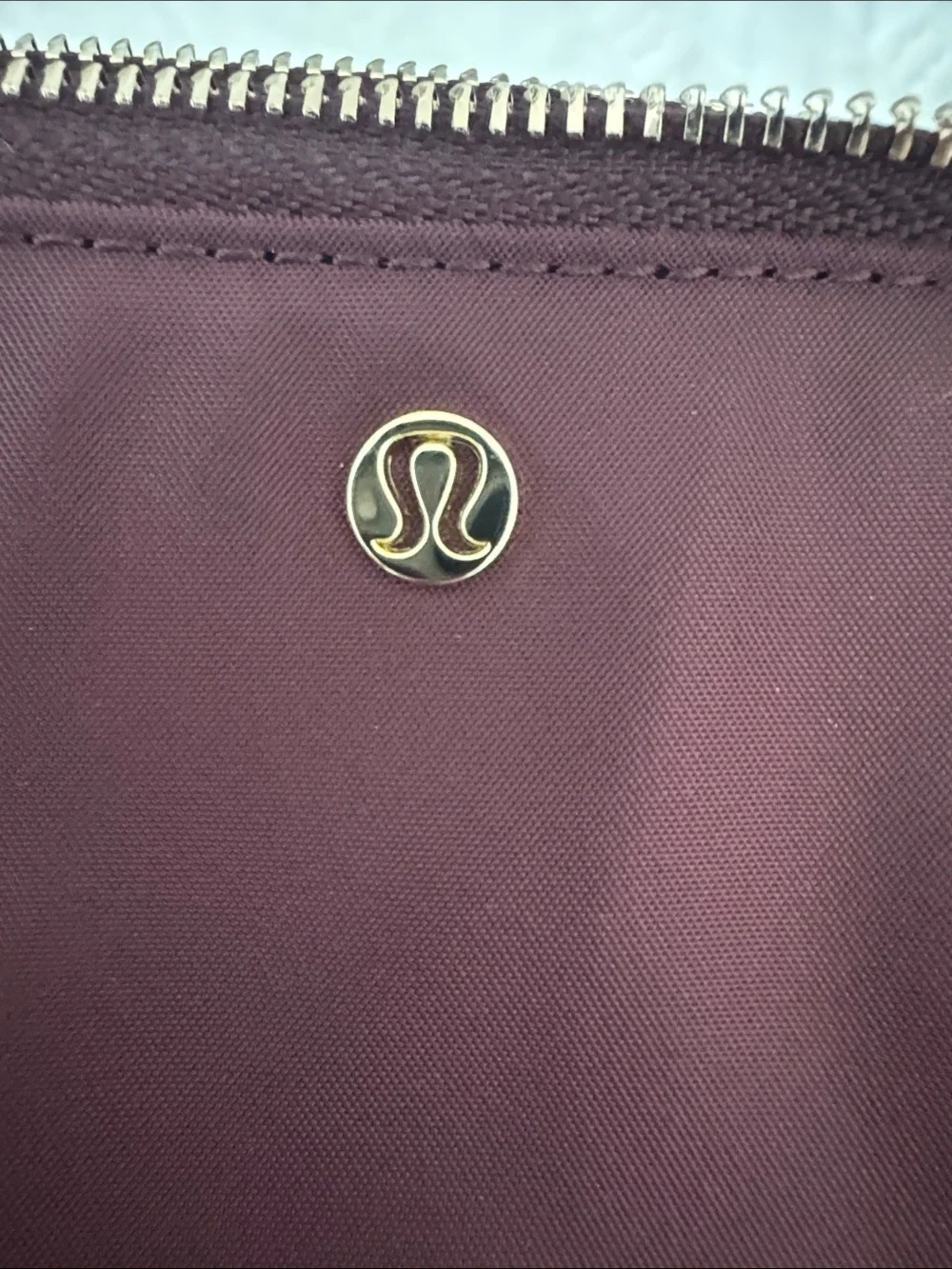 lululemon athletica burgundy key & card holder with gold logo